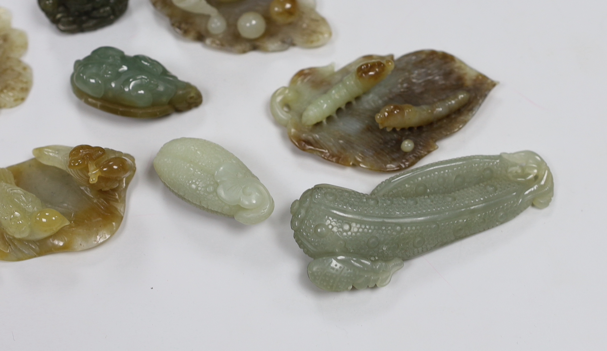 Nine Chinese jade carvings including ducks and caterpillars, the largest 9cm in length